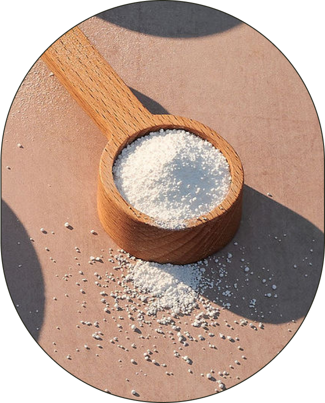 A bowl of Sodium Percarbonate, positioned against a neutral background with thrown shadows.
