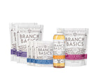 The Full Restock Bundle, featuring a bottle of Branch Basics Concentrate, Oxygen Boost, Laundry Detergent, and Dishwasher Tablets displayed on a white background.