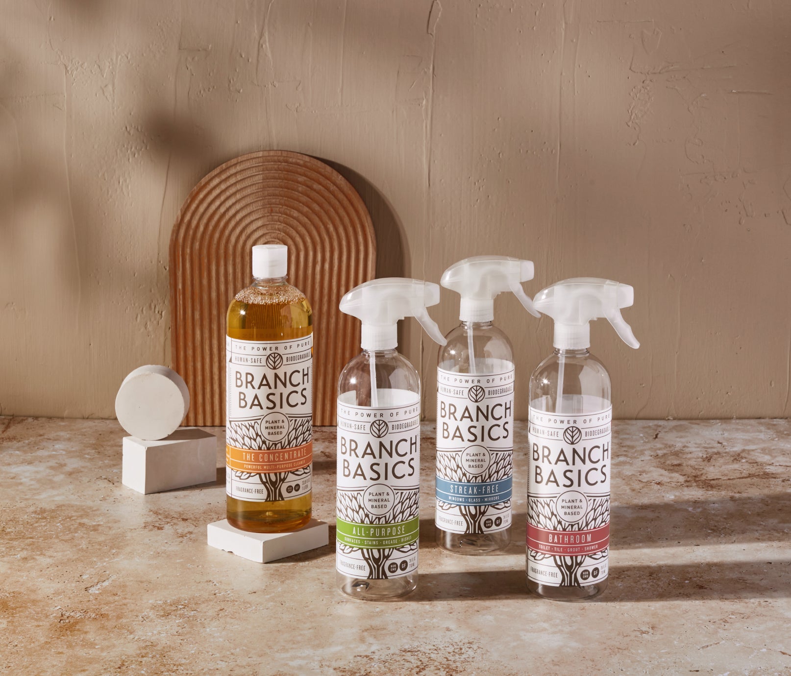 The Cleaning Essentials Kit featuring refillable Plastic bottles, displayed against a neutral background. - View 1
