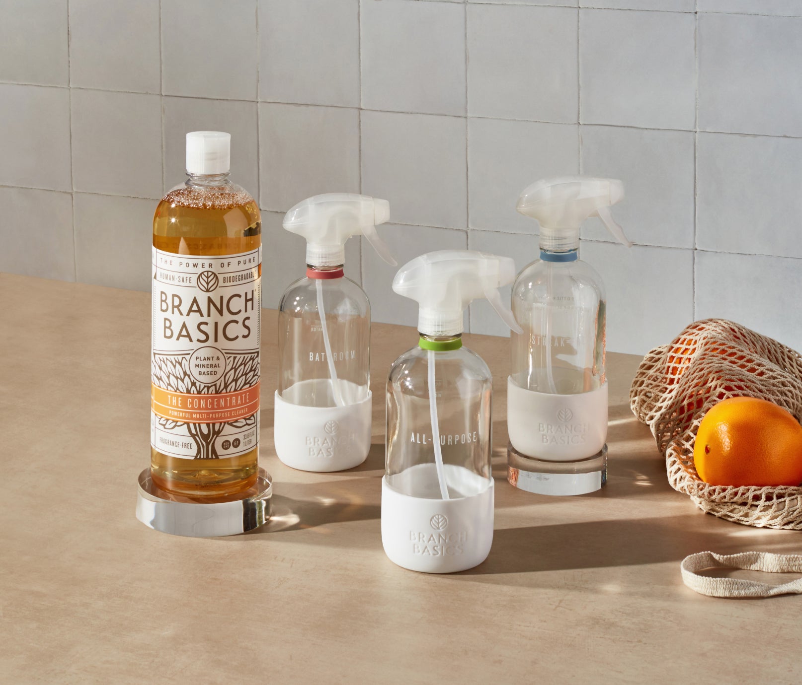 The Cleaning Essentials Kit featuring refillable Glass bottles, displayed against a neutral background. - View 1
