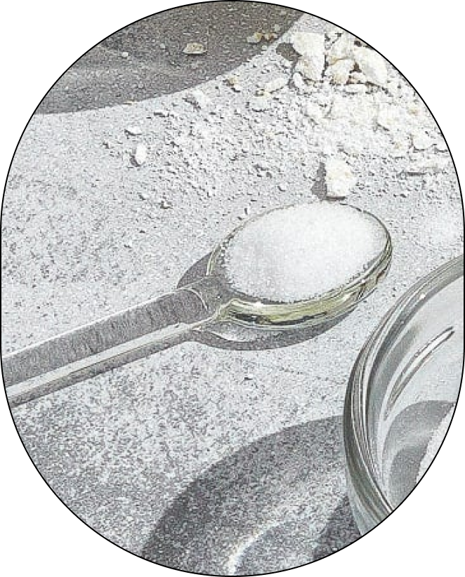 A small, clear spoon containing Poly (itaconic acid-co-AMPS) Sodium Salt, positioned against a neutral background.
