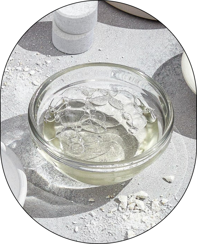 A small, clear bowl containing Sodium Lauryl Sulfoacetate, positioned against a neutral background.
