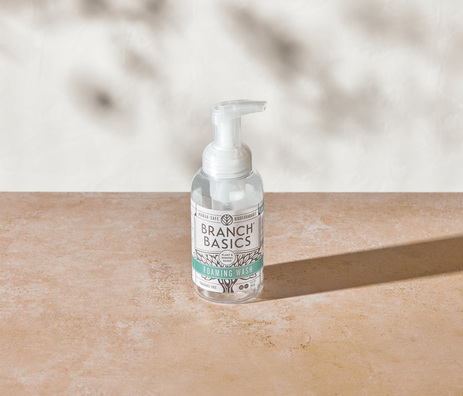 A single refillable Plastic Foaming Wash Bottle, displayed on a neutral surface and white background. - View 2
